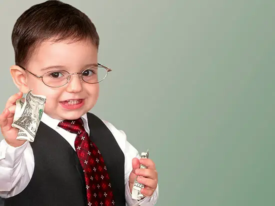 image of child holding money