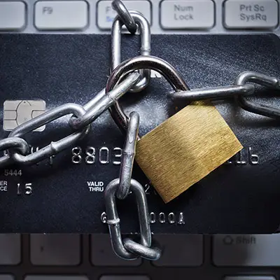 Image of credit cad with chains and lock