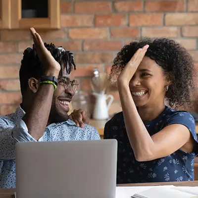 Image of happy couple high-fiving