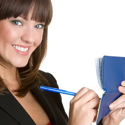 Image of woman writing a check